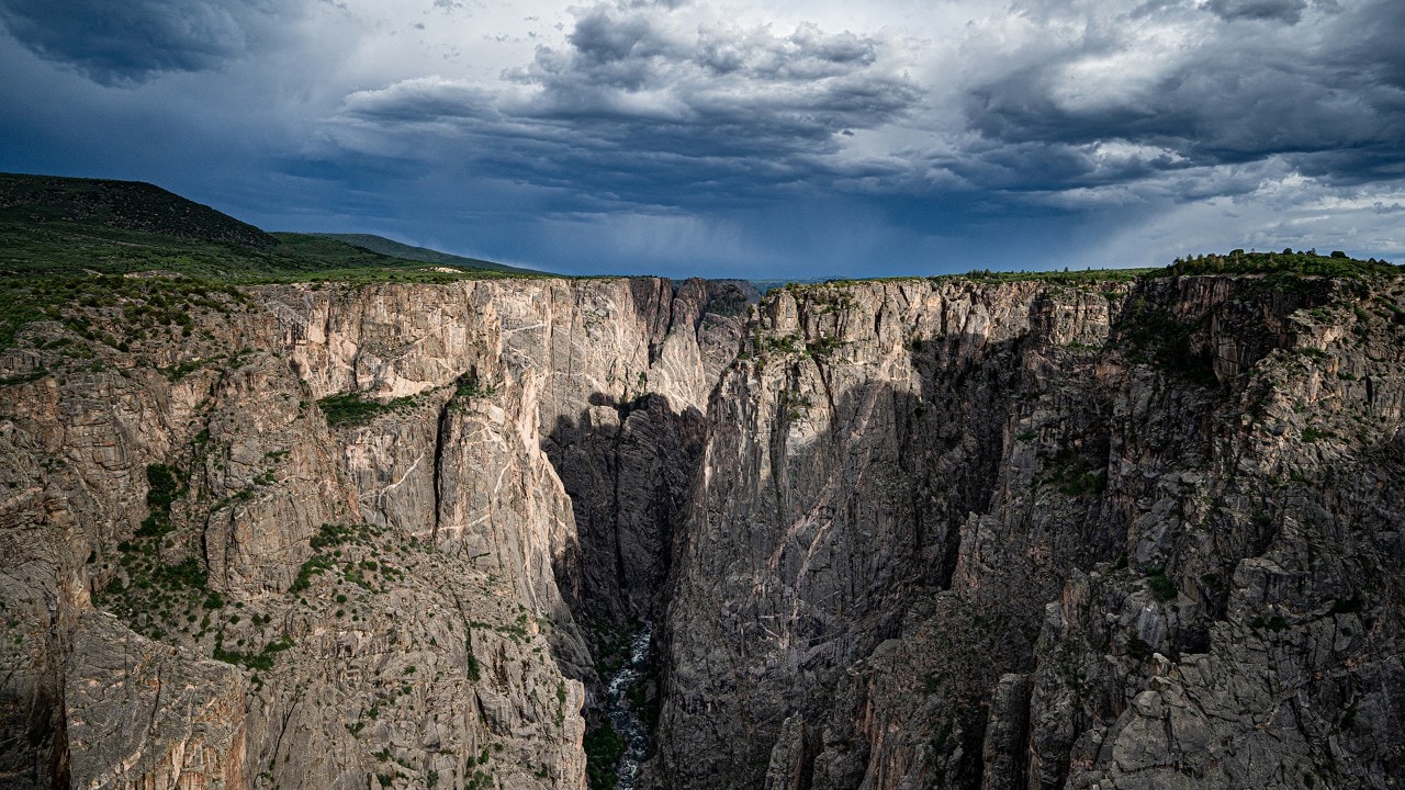 A storm passes near the canyon in this view from the north rim.
