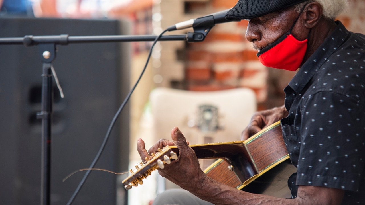 Jimmy "Duck" Holmes performs outside of the Cat Head record store in Clarksdale.