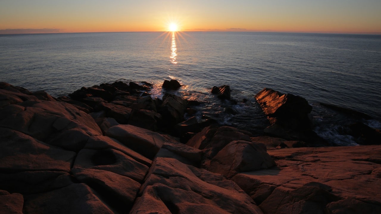 The sun rises at Lakies Head on the eastern shore.