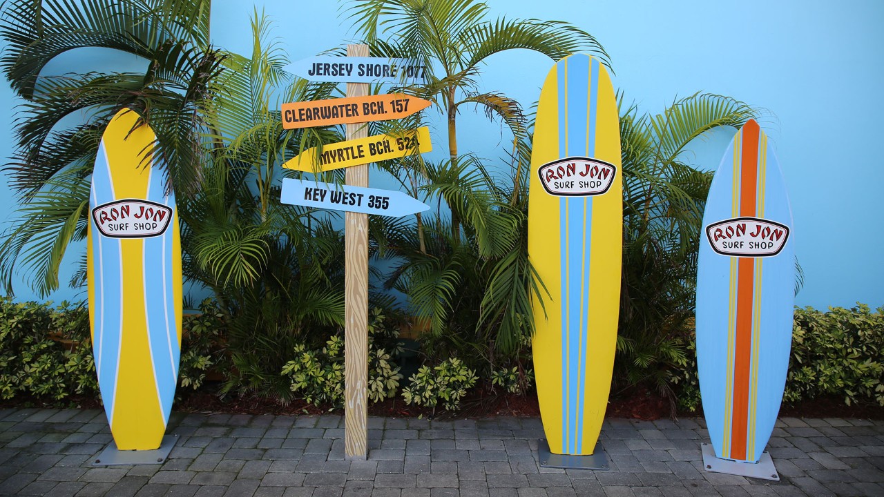 Pose with a surfboard at Ron Jon Surf Shop.