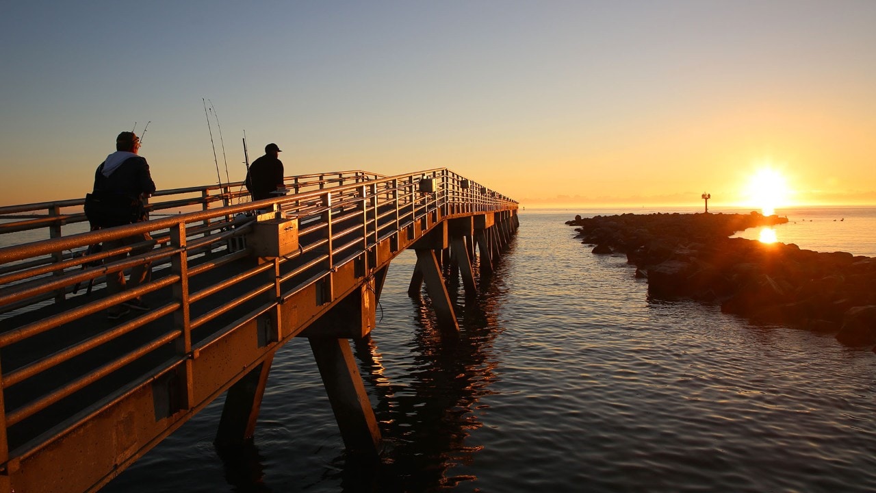 Fishermen try their luck at Jetty Park Pier.