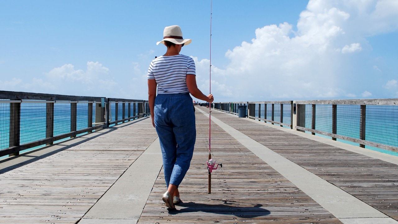 The author leaves with her pink fishing pole at Navarre Beach Fishing Pier.