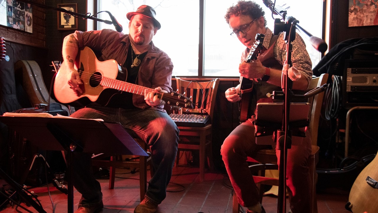 Tim Cheesebrow (left) and Pete McCauley of the duo Mac and Cheese play at Merlins Rest Pub in Minneapolis, Minnesota. 