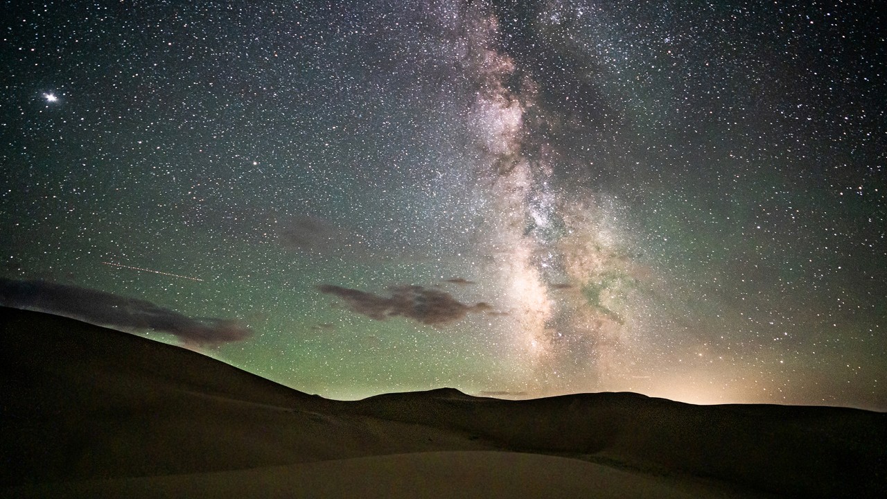 The Milky Way shines over Great Sand Dunes National Park.