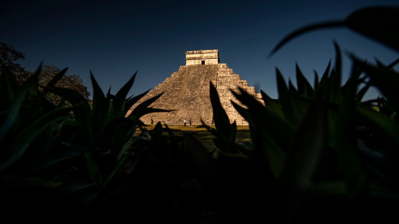 The rising sun lights up the Temple of Kukulcan at Chichén Itzá.