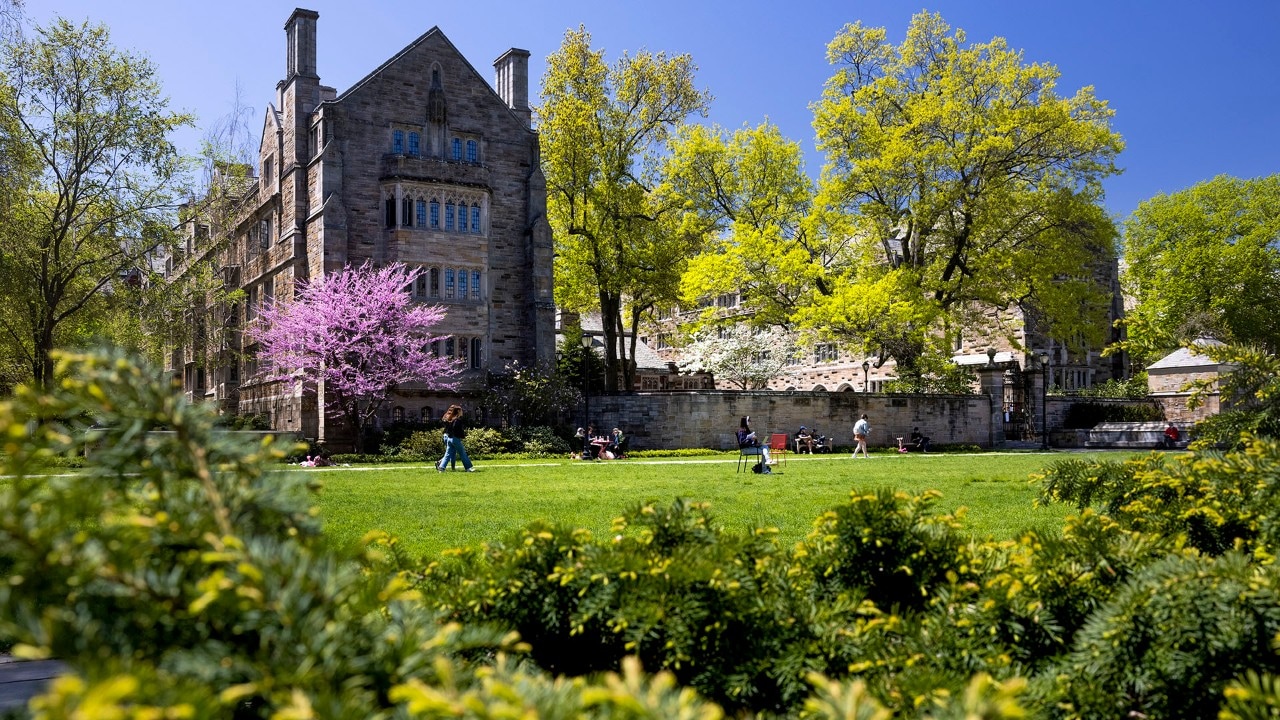 People walk through Cross Campus at Yale University in New Haven.