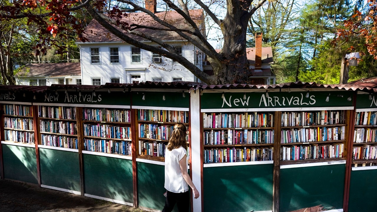 A woman peruses some of the 500,000 books at the Book Barn in Niantic, Connecticut.