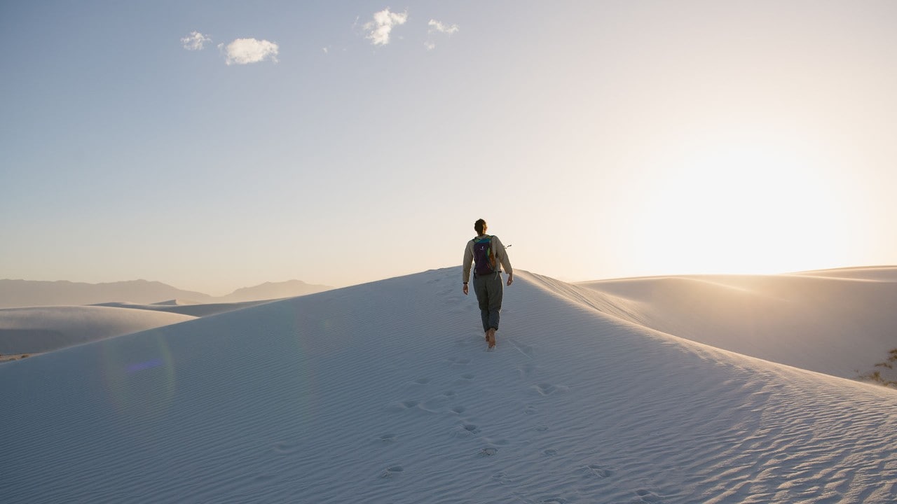 The author walks in White Sands National Park.