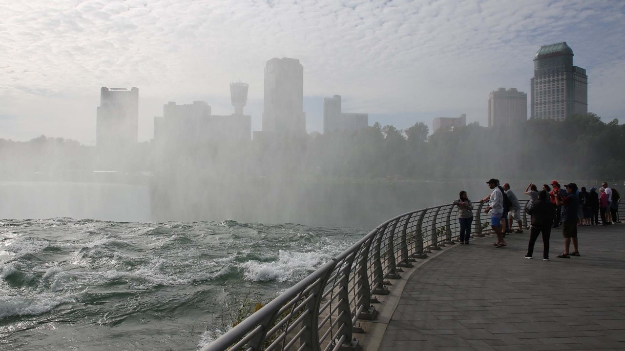 People admire Horseshoe Falls from Terrapin Point on the New York side. 
