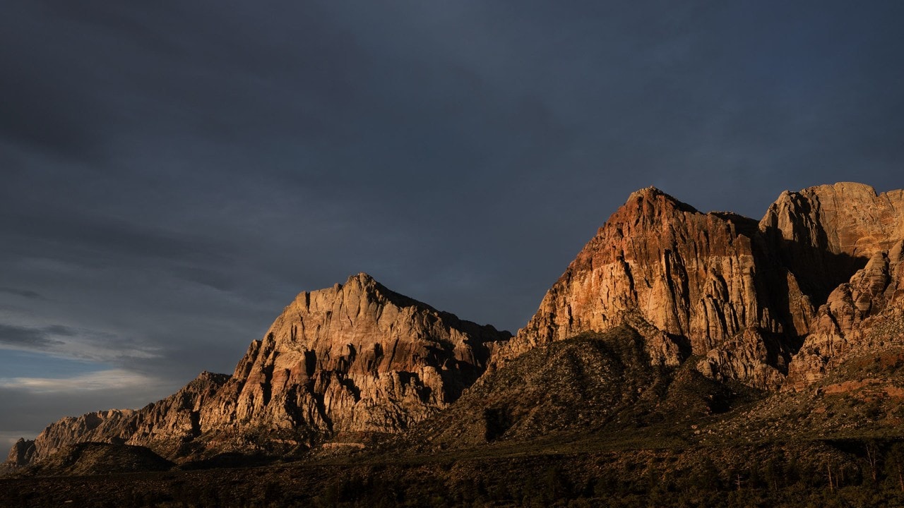 The sun rises on Rainbow Mountain and Mount Wilson in Red Rock Canyon.