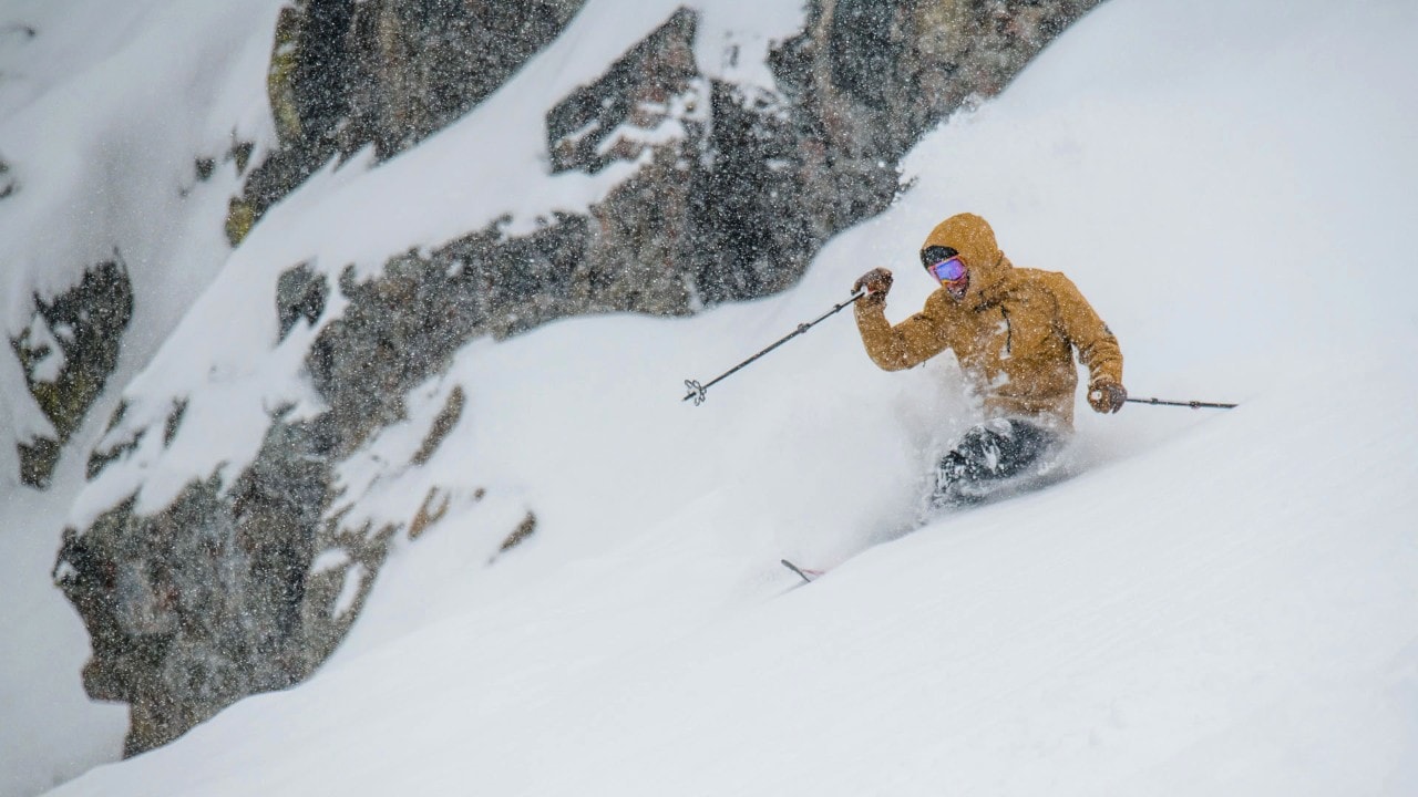 A skier plows through fresh powder at Lost Trail Powder Mountain. 