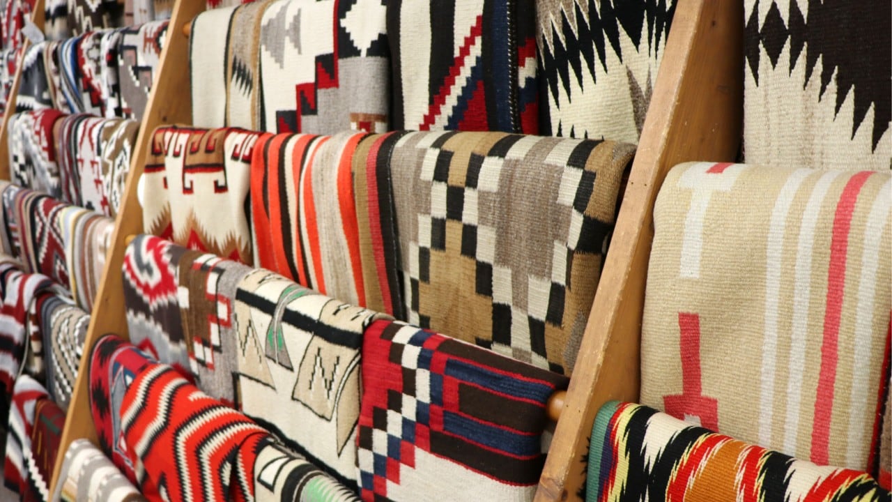 Navajo weavings line a wall of the Notah-Dineh Trading Co. in Cortez, Colorado.
