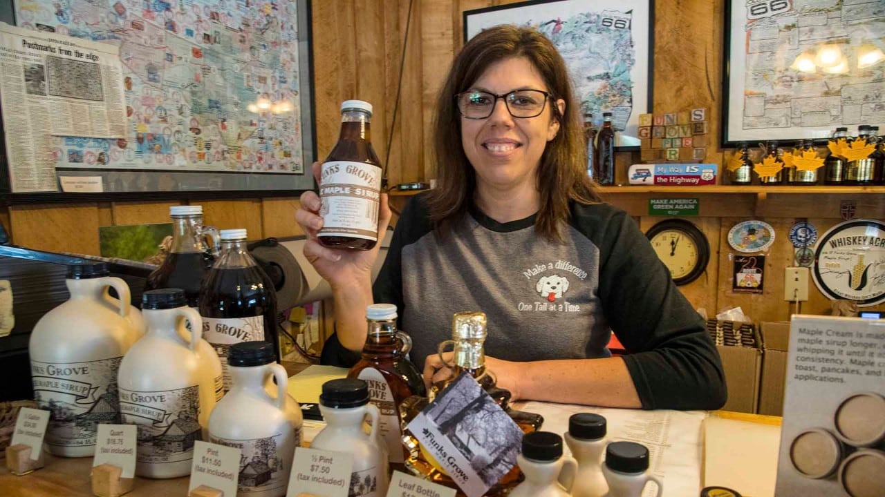 Lisa Kirby shows products at Funks Grove Pure Maple Sirup near Funks Grove, Illinois. The Funk family has been making maple sirup since 1891.