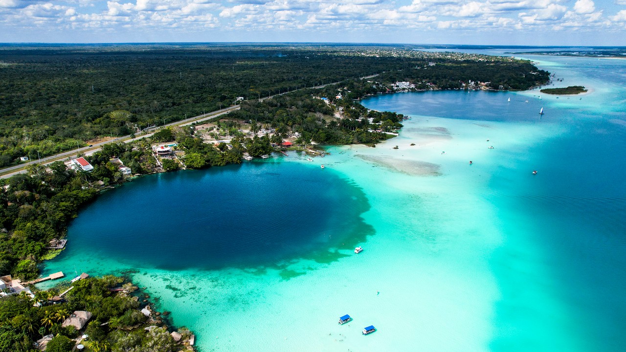 Cenote Cocalitos, left, and Cenote Esmeralda sit on the edge of the Bacalar Lagoon and reach a depth of 200 feet.