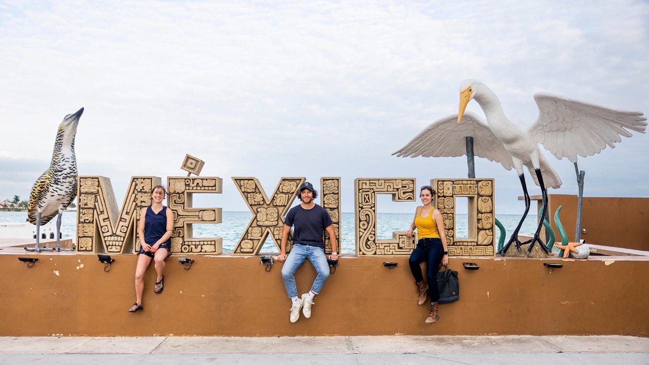 From left, Corey, Max and Kassondra pose in Chetumal, Mexico.