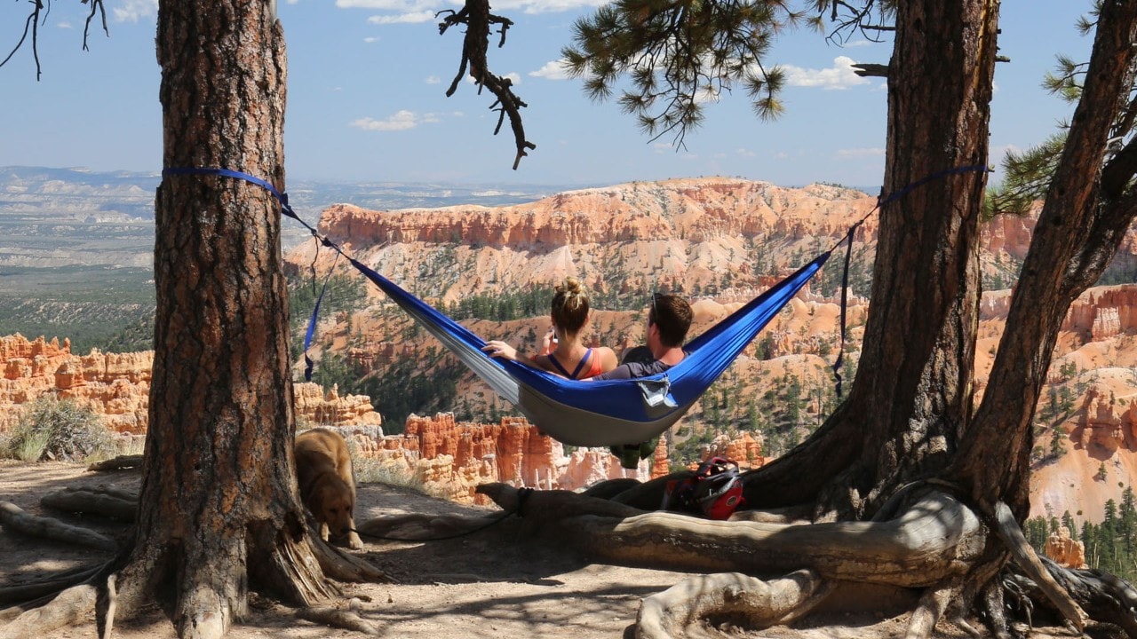 A couple relaxes at the Amphitheater in Bryce Canyon National Park.