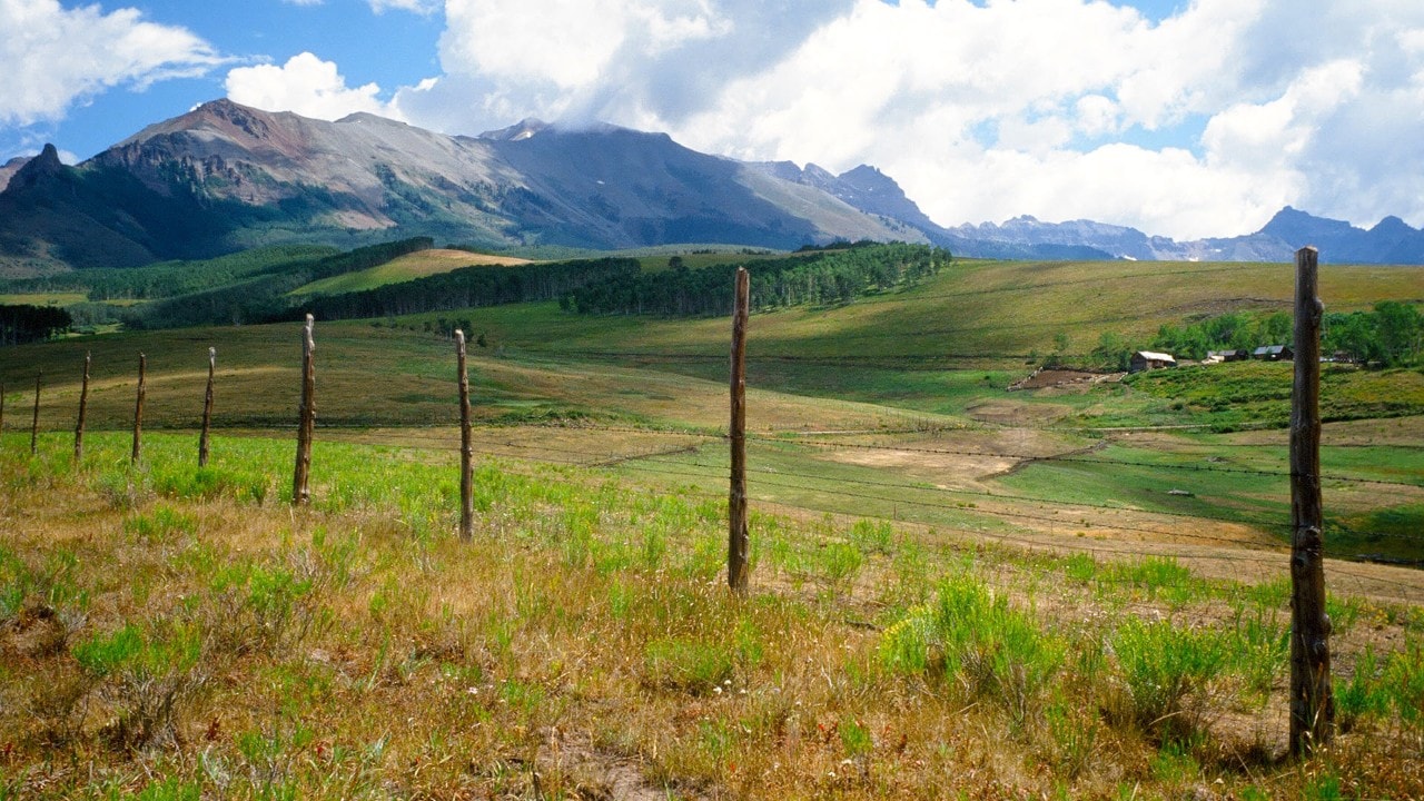 Ranchland surrounds the approach to Wilson Peak near Telluride. Photo by Connie Gelb Otteman