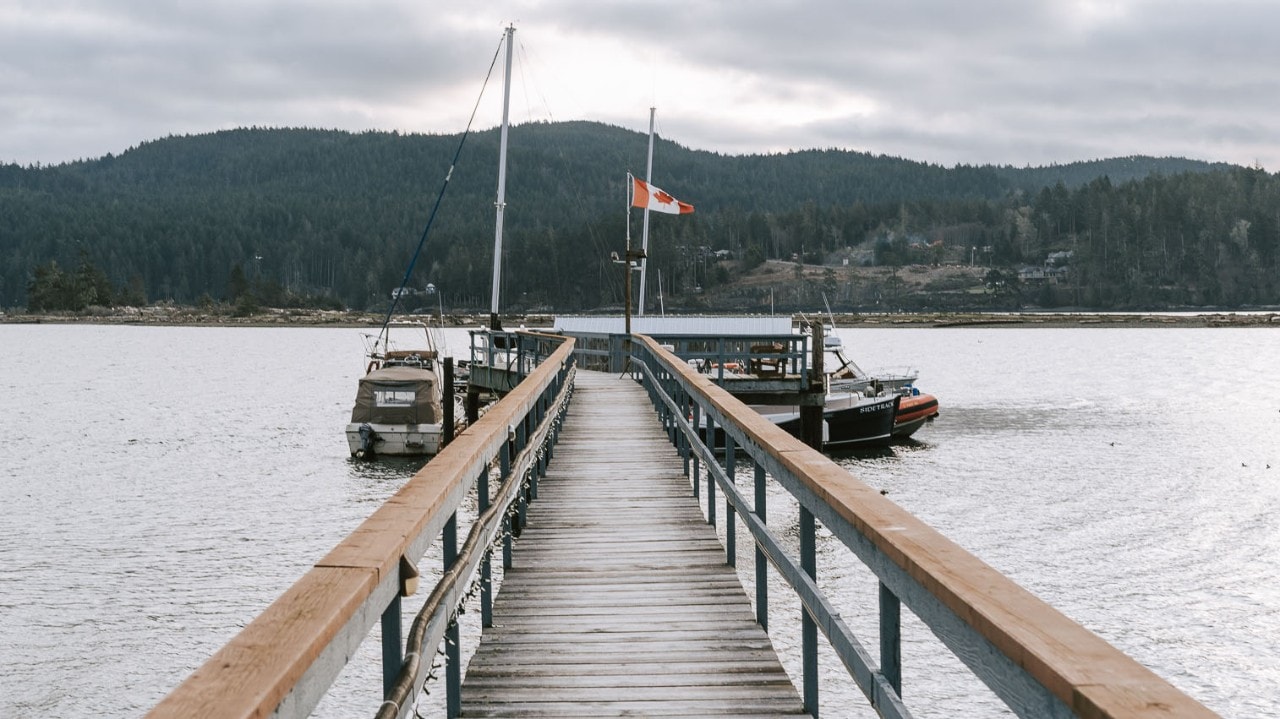 The Canadian flag flies on a dock in Sooke Harbour.