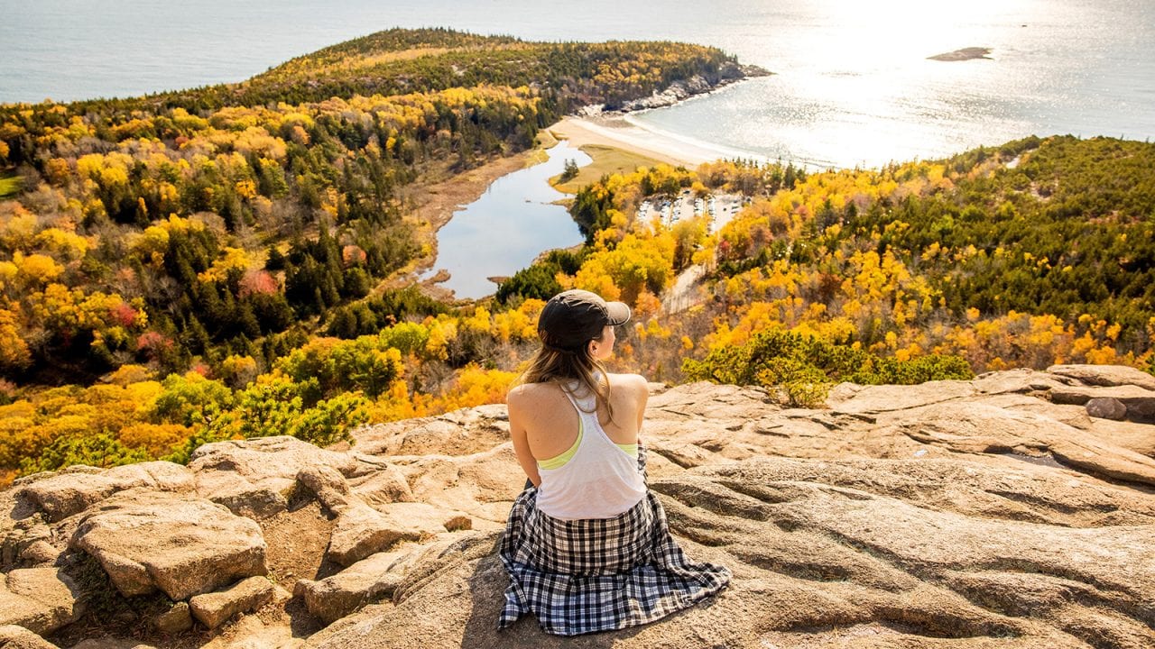 Sarah Lozano enjoys the view from the top of the Beehive Trail in Acadia National Park