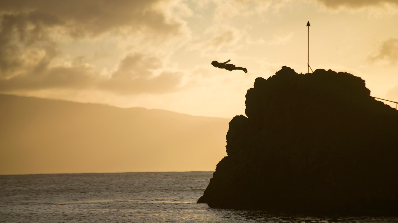 A diver leaps during the traditional ceremony along Ka’anapali Beach. 