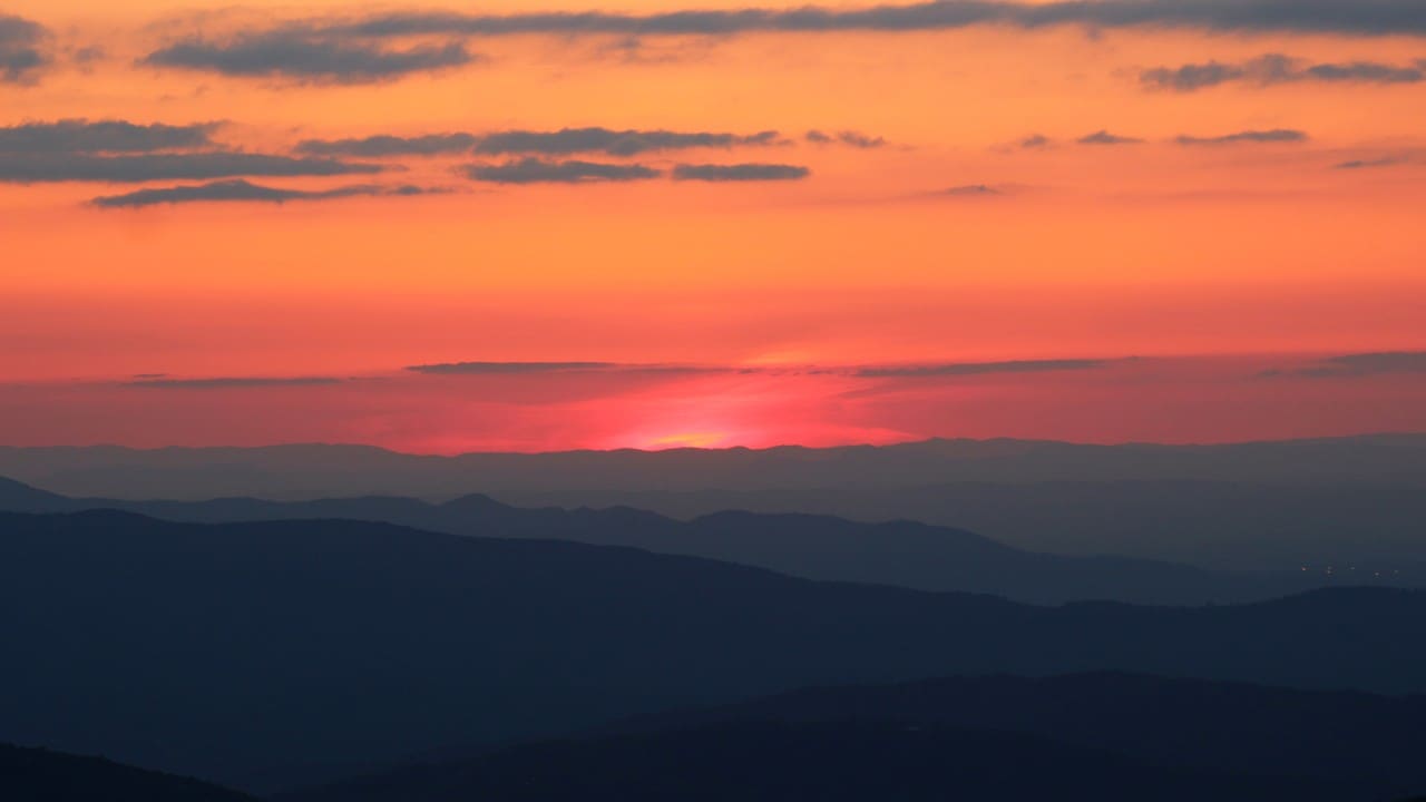 The sun slips behind silhouettes of the Appalachian Mountains. Photo by Emanuel Vinkler
