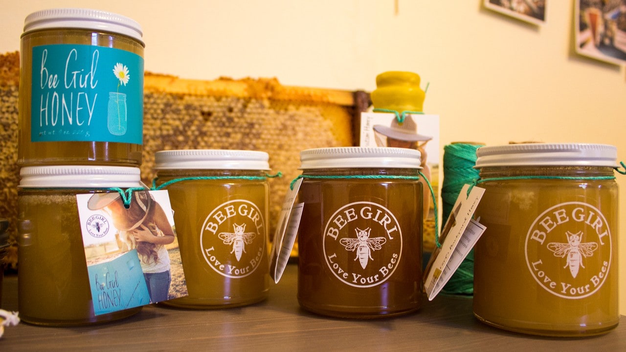 Sarah collects, packages and sells her raw wildflower honey. Profits go directly toward bee education and habitat conservation. Photo by Jay Zschunke