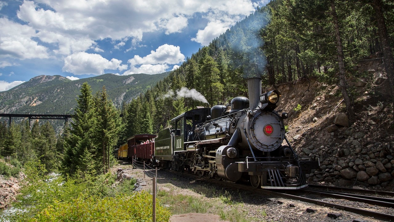 The Georgetown Loop Railroad was completed in 1884. The train runs between Georgetown and Silver Plume, Colorado.