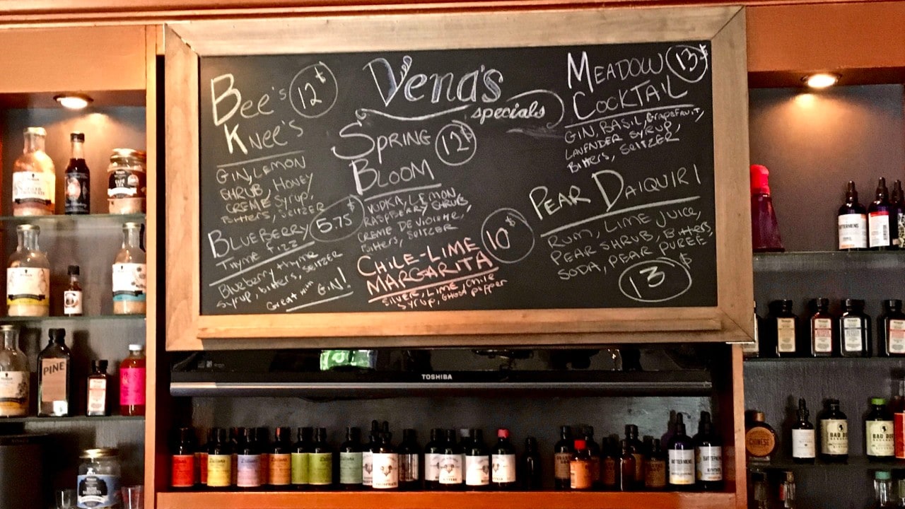 A chalkboard announces the daily specials at Vena's Fizz House.