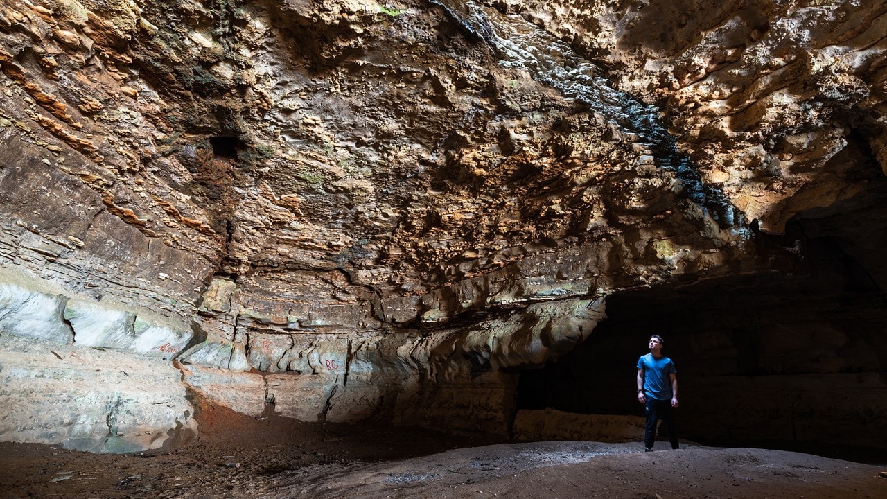 The author explores Cave-in-Rock, which was carved out of the limestone rock by water thousands of years ago.