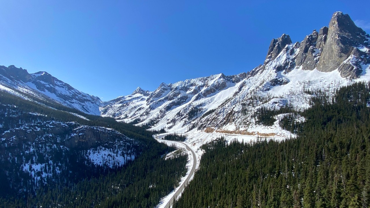 The North Cascades Highway ascends toward Liberty Bell Mountain and Early Winters Spires..