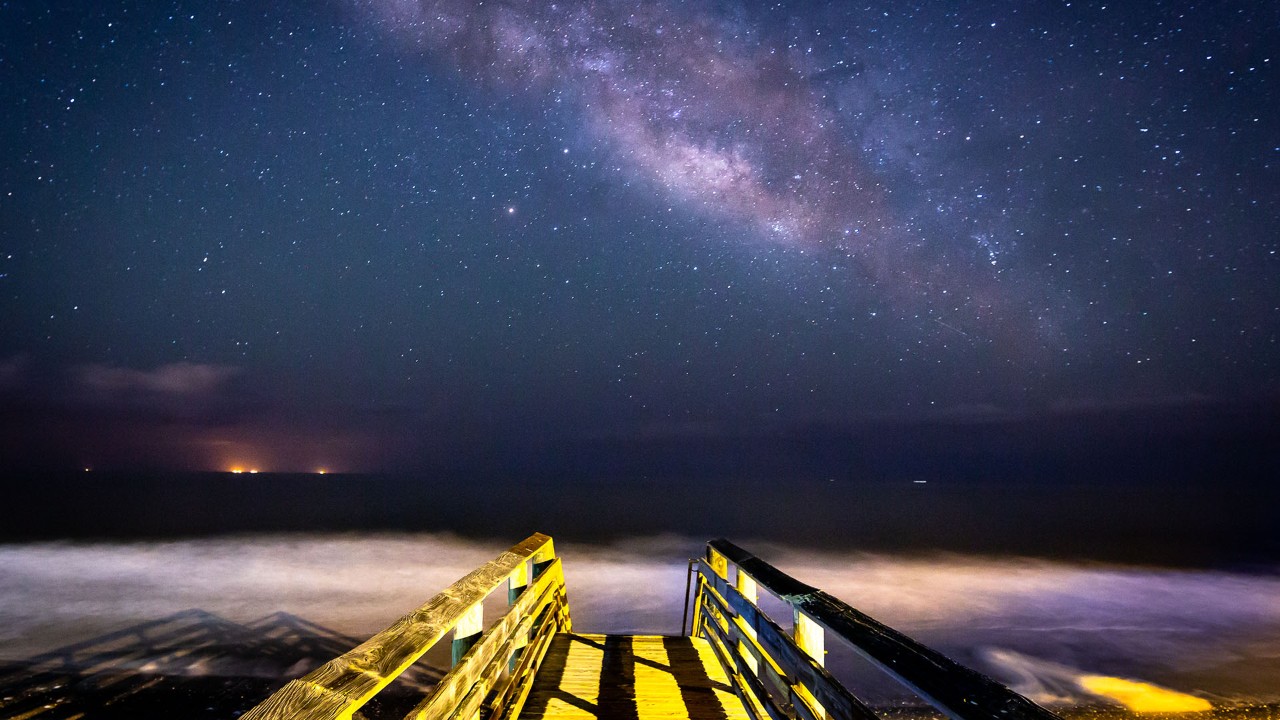 The Milky Way stretches across the Atlantic Ocean at Folly Beach.