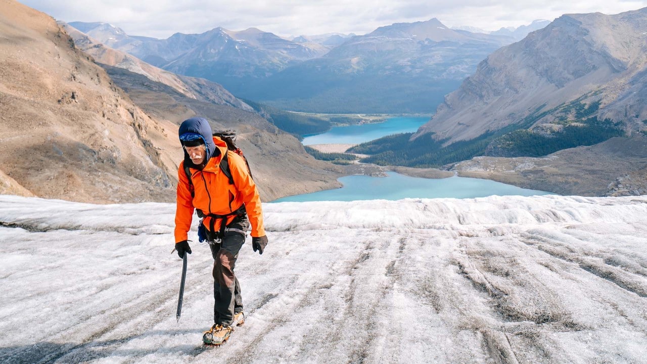 Guide Dave McCashin walks on a glacier overlooking Iceberg Lake.