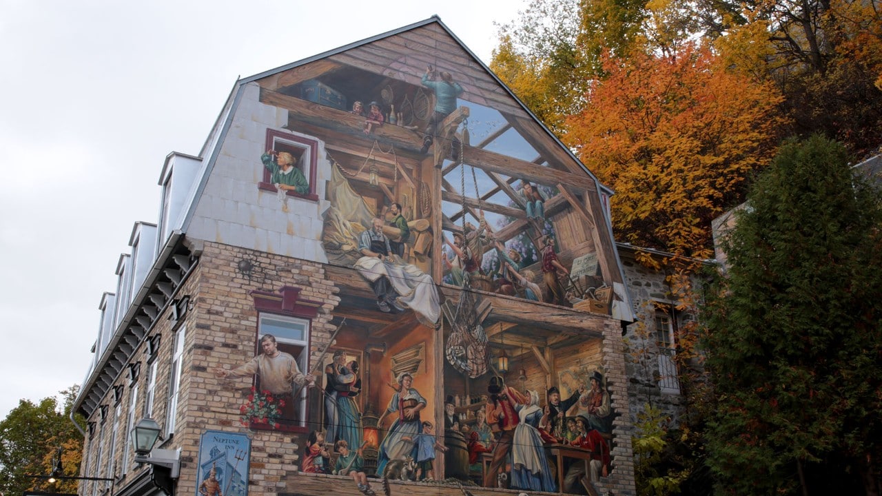 The Petit-Champlain fresco depicts the history of Quebec City's working-class waterfront neighborhood.
