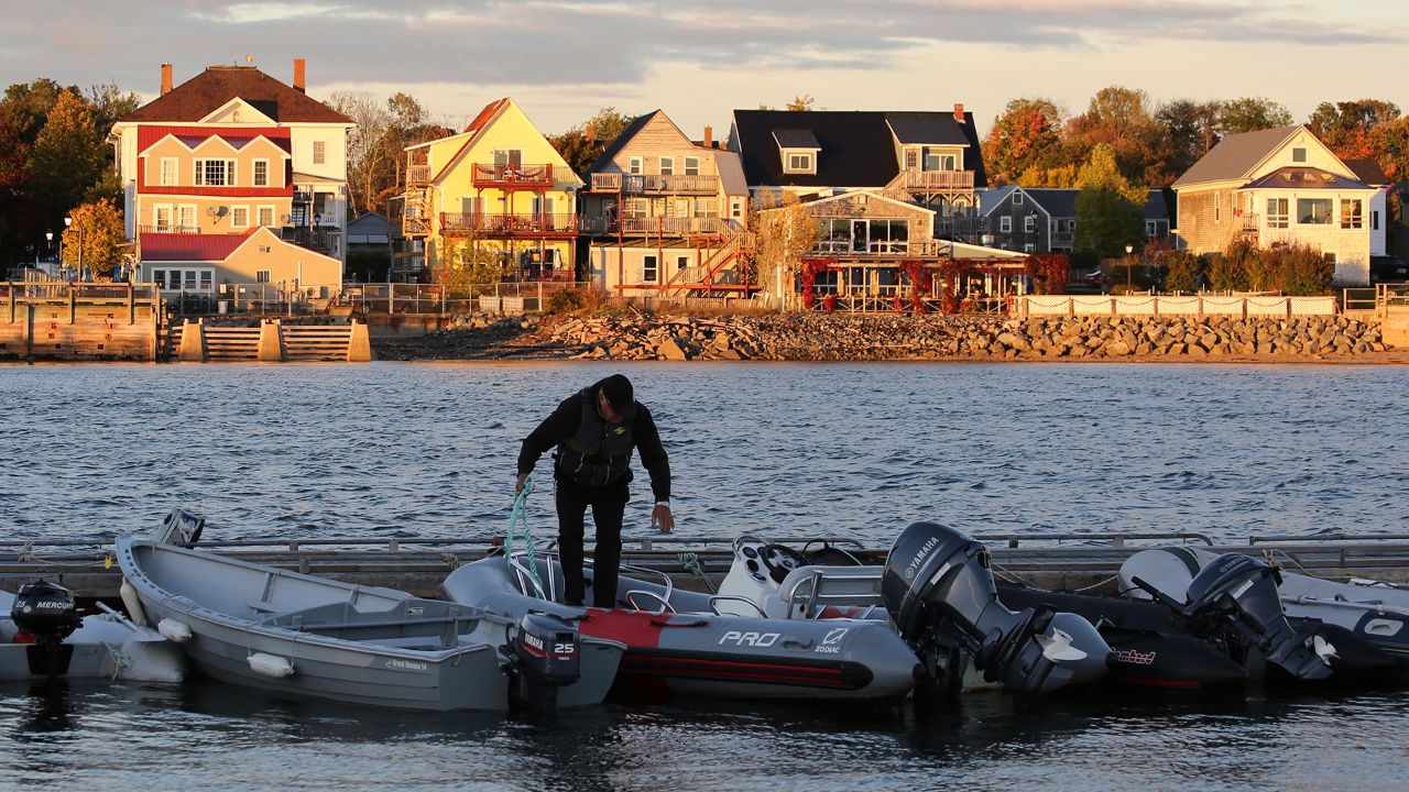 A man in St. Andrews prepares to take a boat into Passamaquoddy Bay.