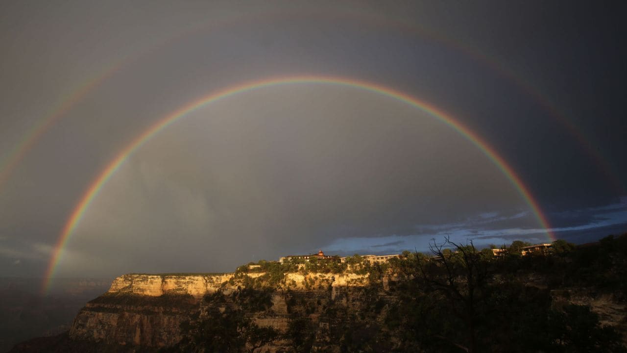 A double rainbow shines over El Tovar Hotel on the Grand Canyon's South Rim the night before the hike.