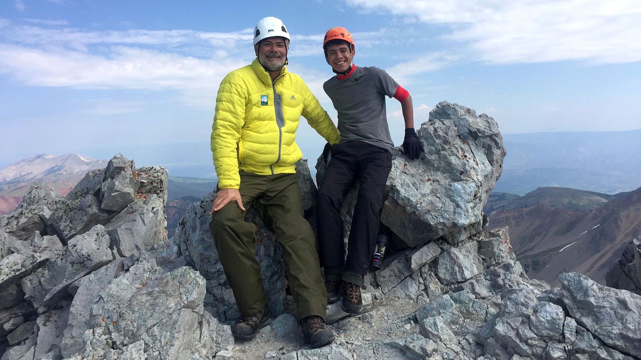 Scott (left) and Daniel Otteman sit atop Mount Wilson. Photo by Connie Gelb Otteman