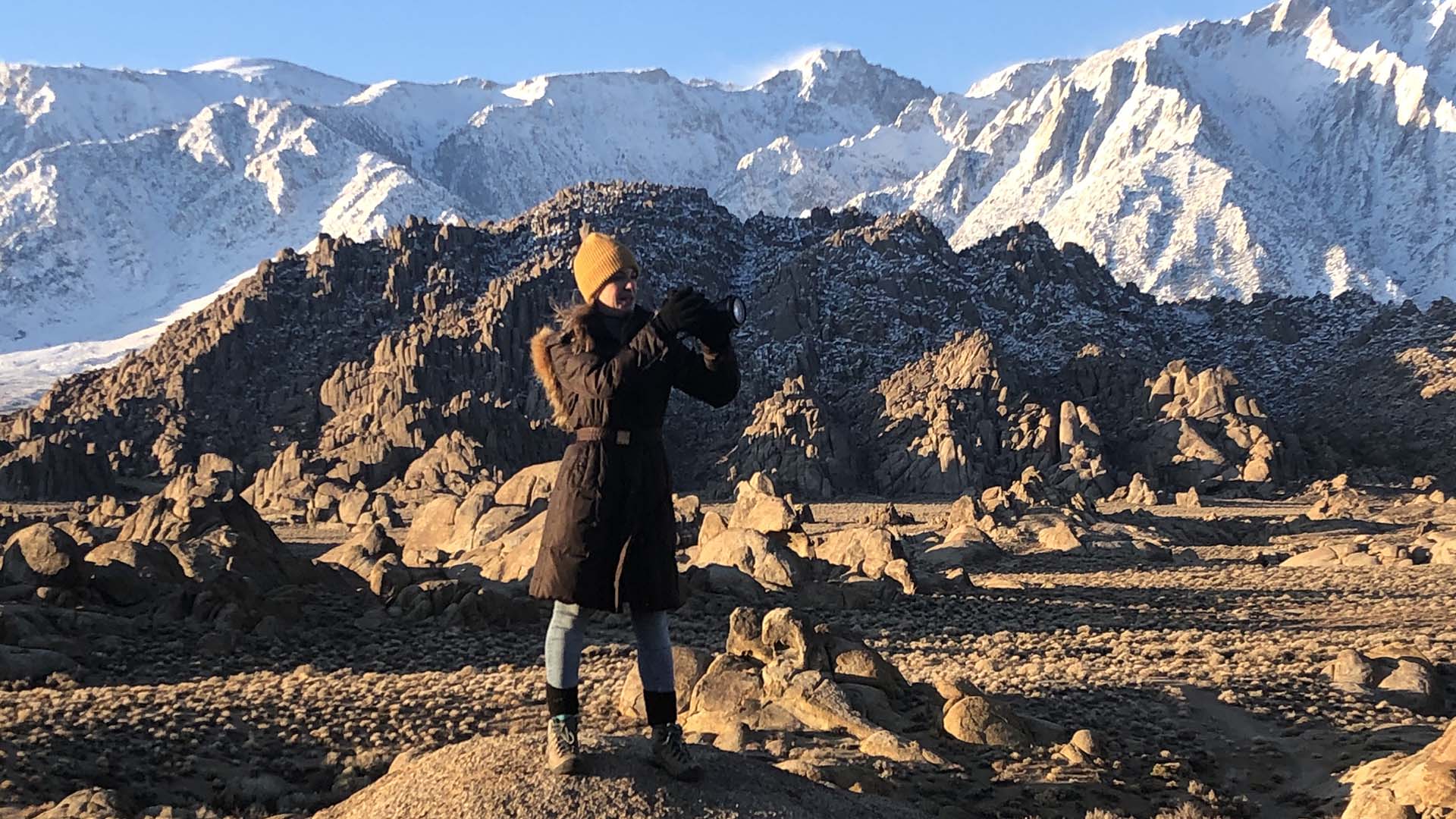 A traveler photographs the pristine mountain views in California's Eastern Sierra. Photo by Megan Snedden