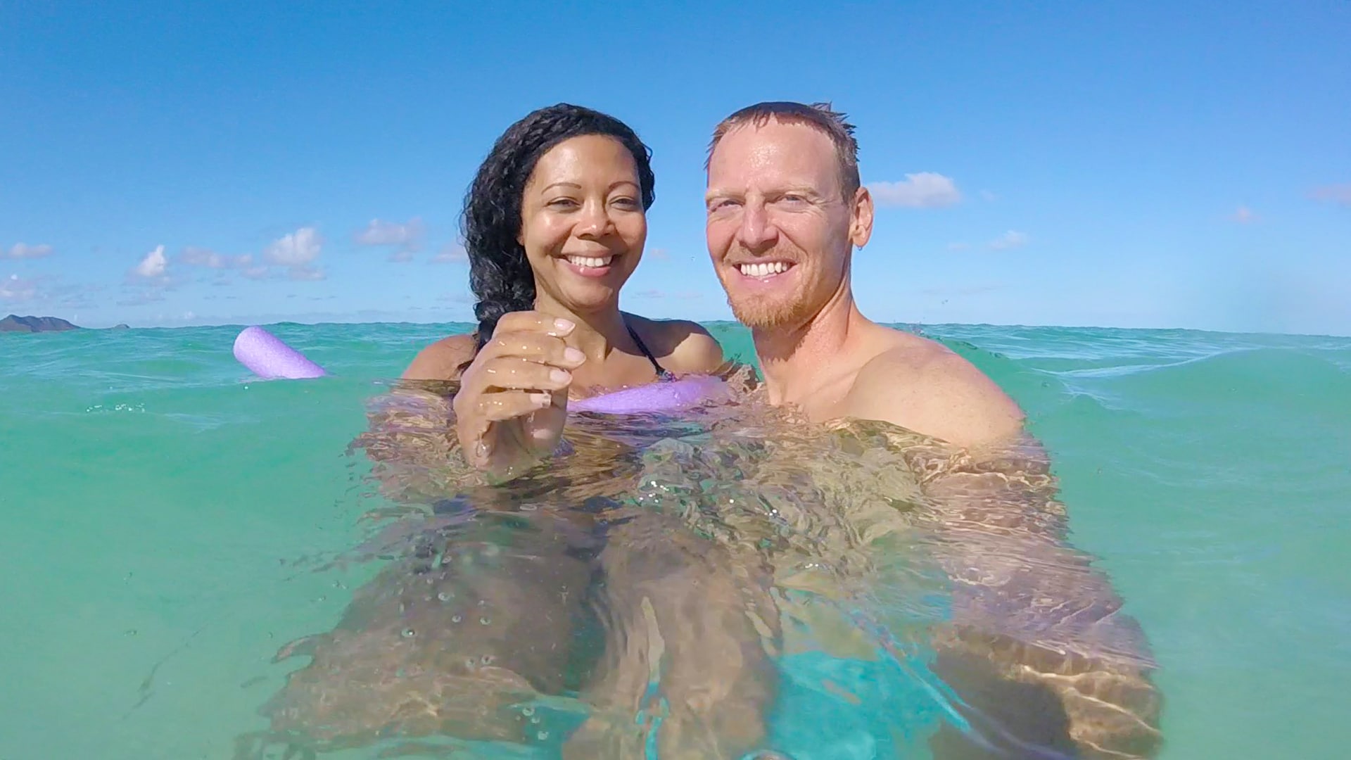 The writer, Joe, and his wife, Hailima, enjoy a swim off the coast of Oahu.