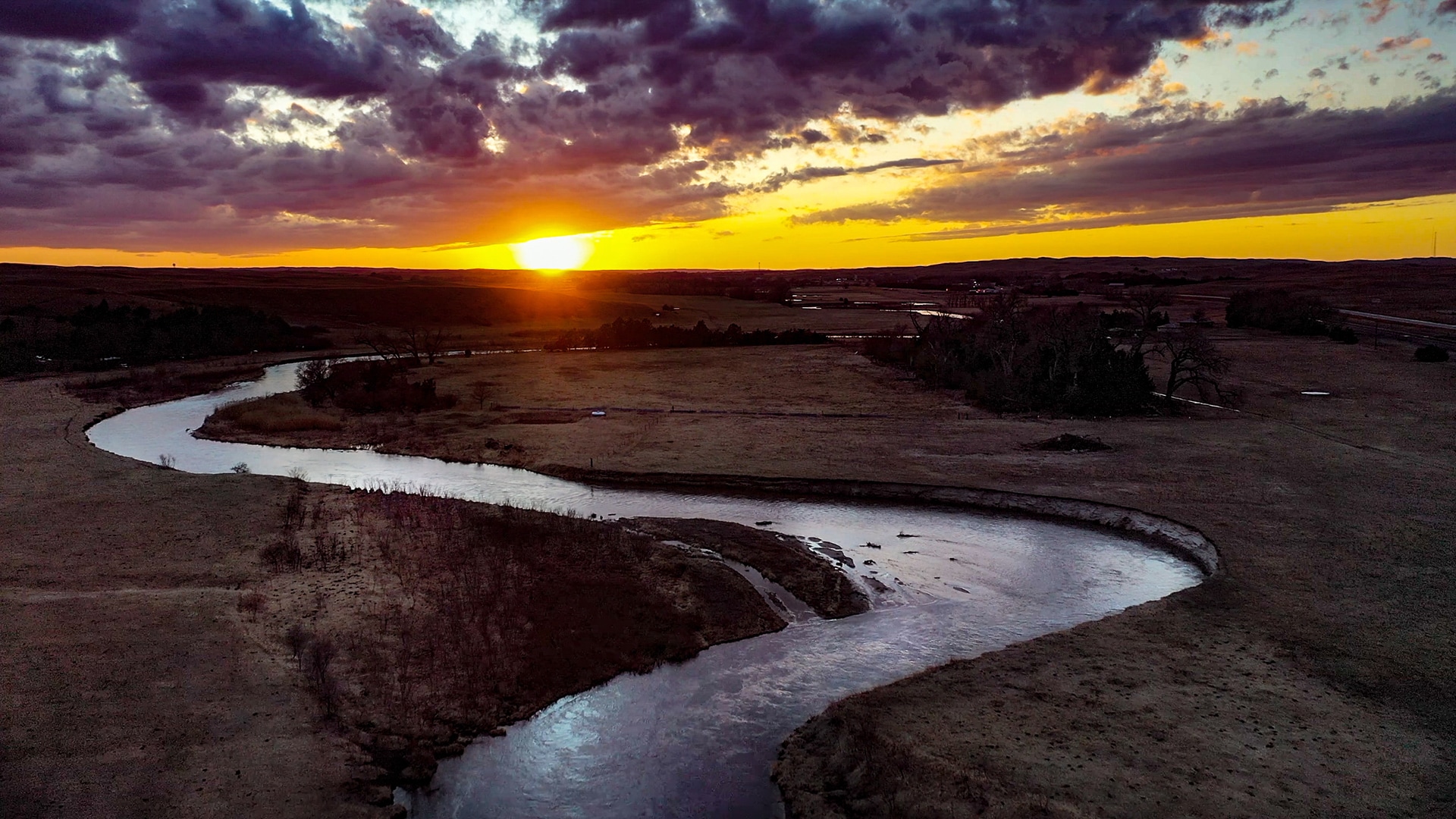 The sun sets on the Middle Loup River near Thedford, Nebraska.