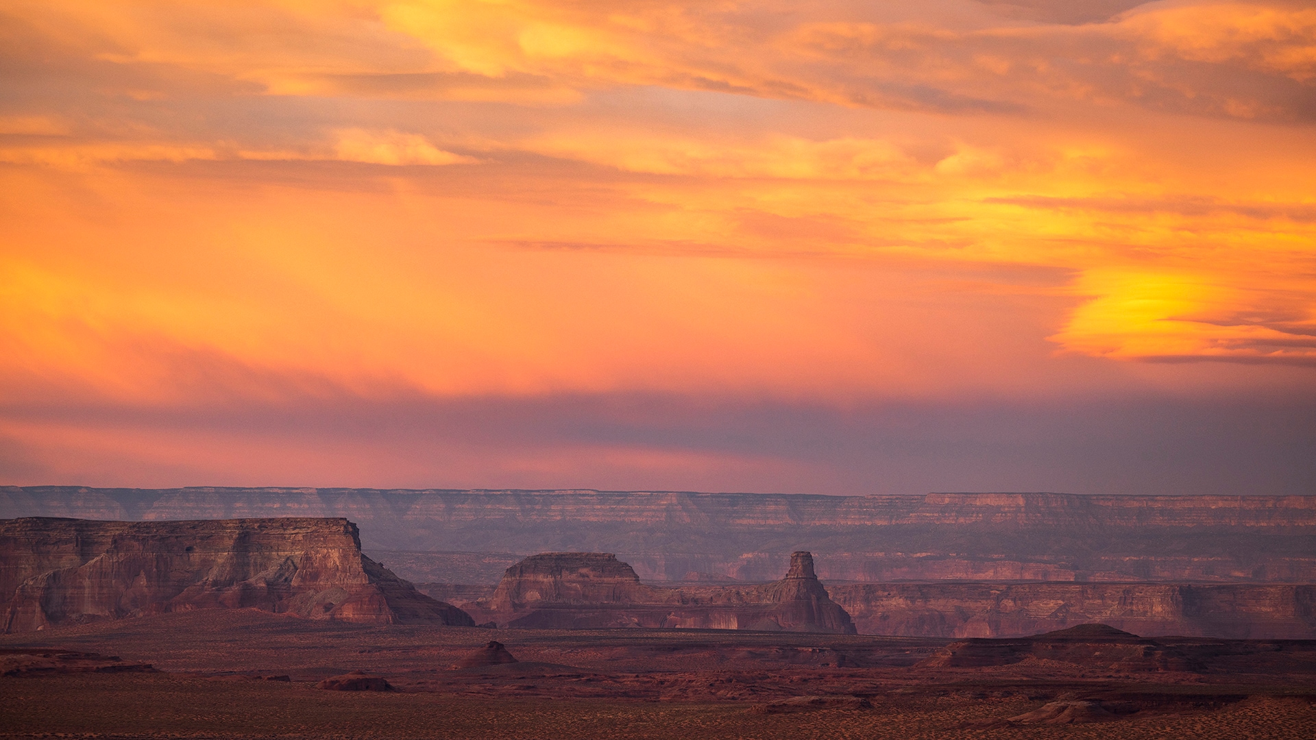 The sunset lights up the sky over Lake Powell as seen from Grandview Overlook in Page, Arizona.