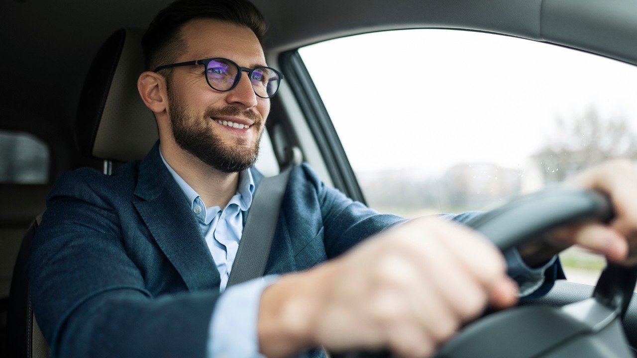 Businessman driving his car