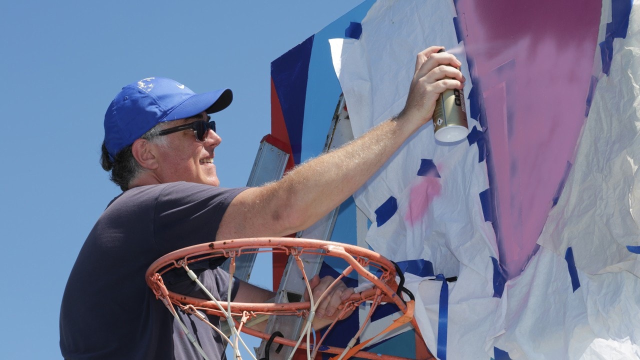 One of six backboards painted at the court.