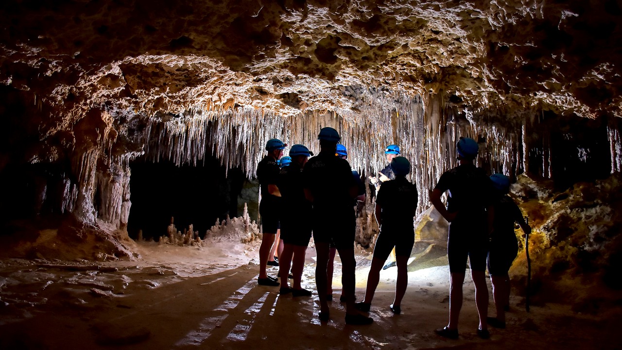 Visitors learn about the cave's geological formations. Photo courtesy of Michael Ciaglo