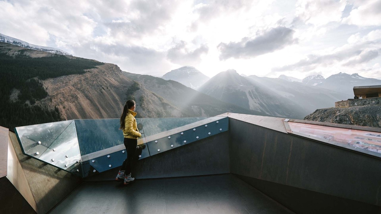 The clouds part momentarily as the sun sets on the Columbia Icefield Skywalk.