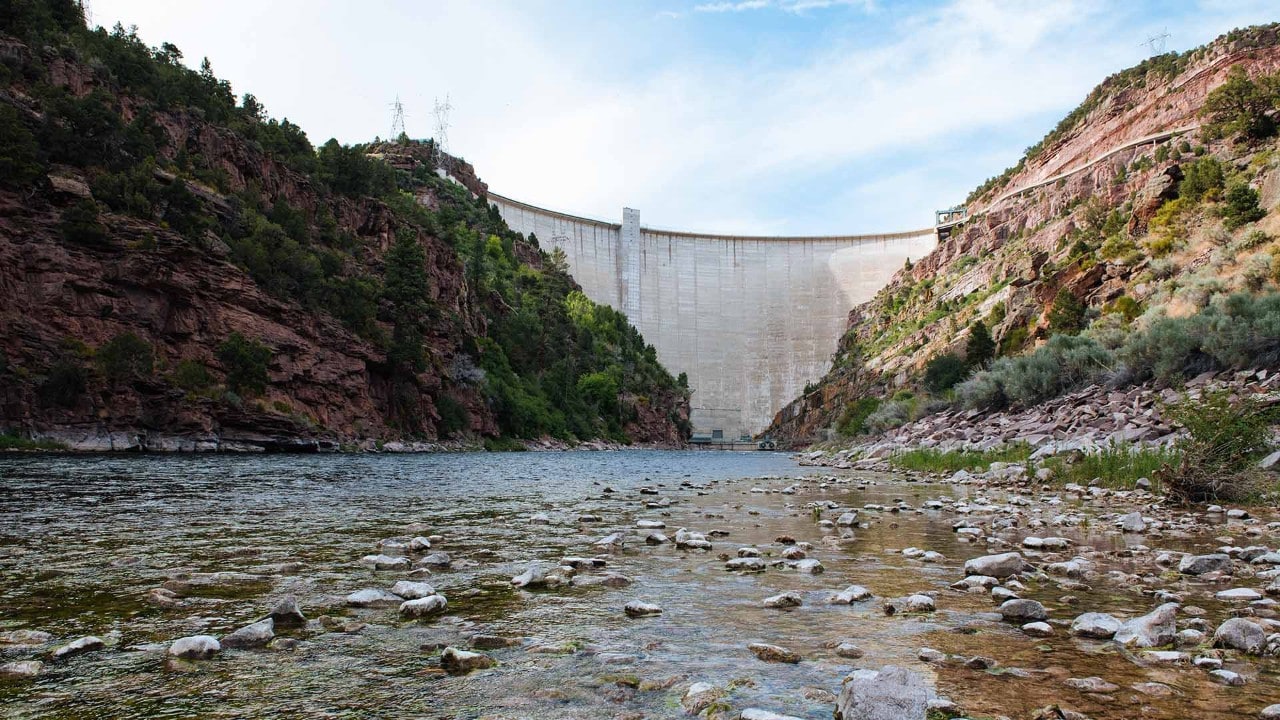 The Flaming Gorge Dam near Dutch John, Utah, rises more than 500 feet above the Green River.