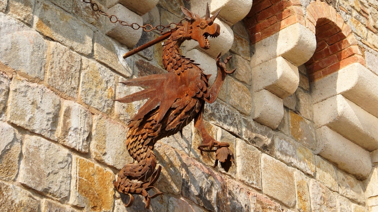 A handcrafted iron dragon guards Castello di Amorosa.