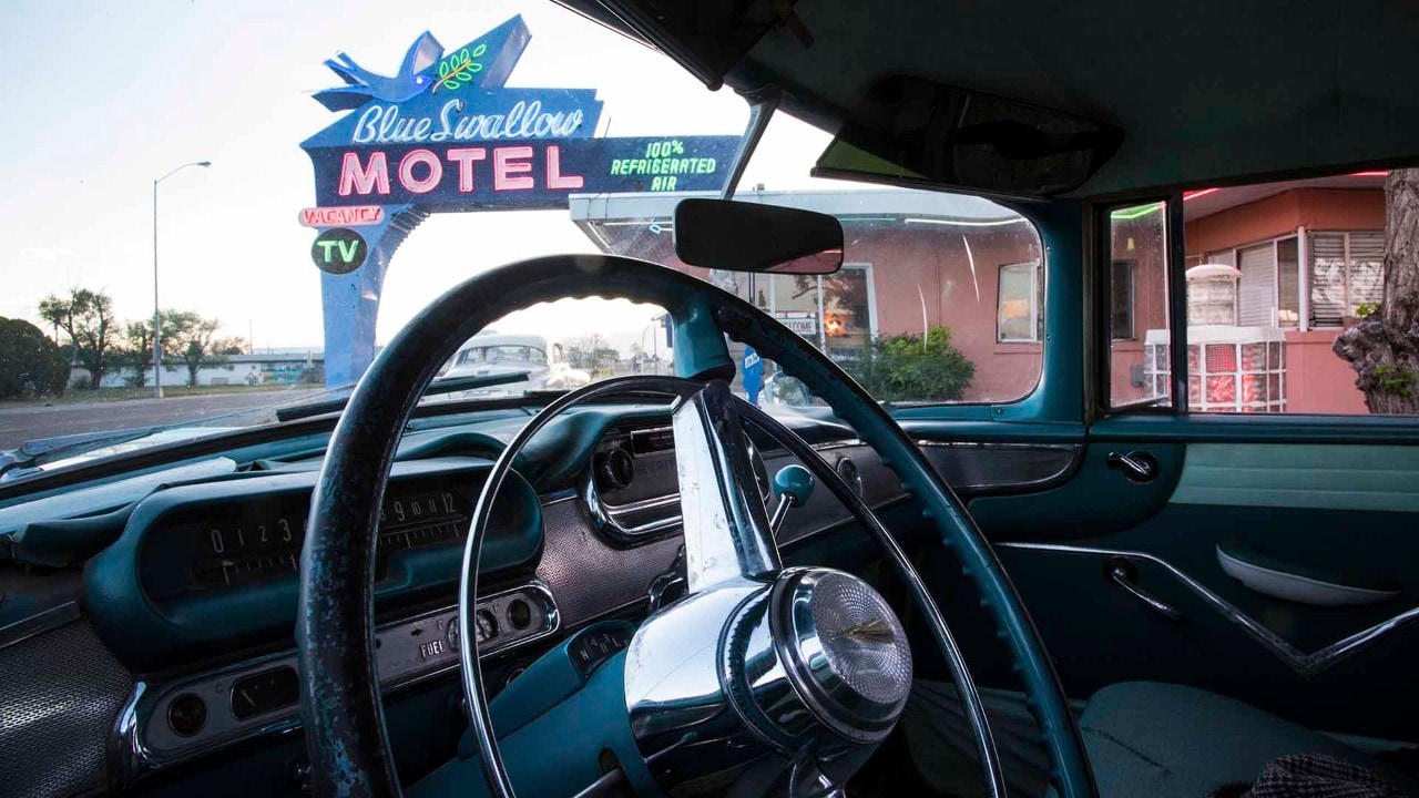A vintage car sits outside of the Blue Swallow Motel in Tucumcari, New Mexico
