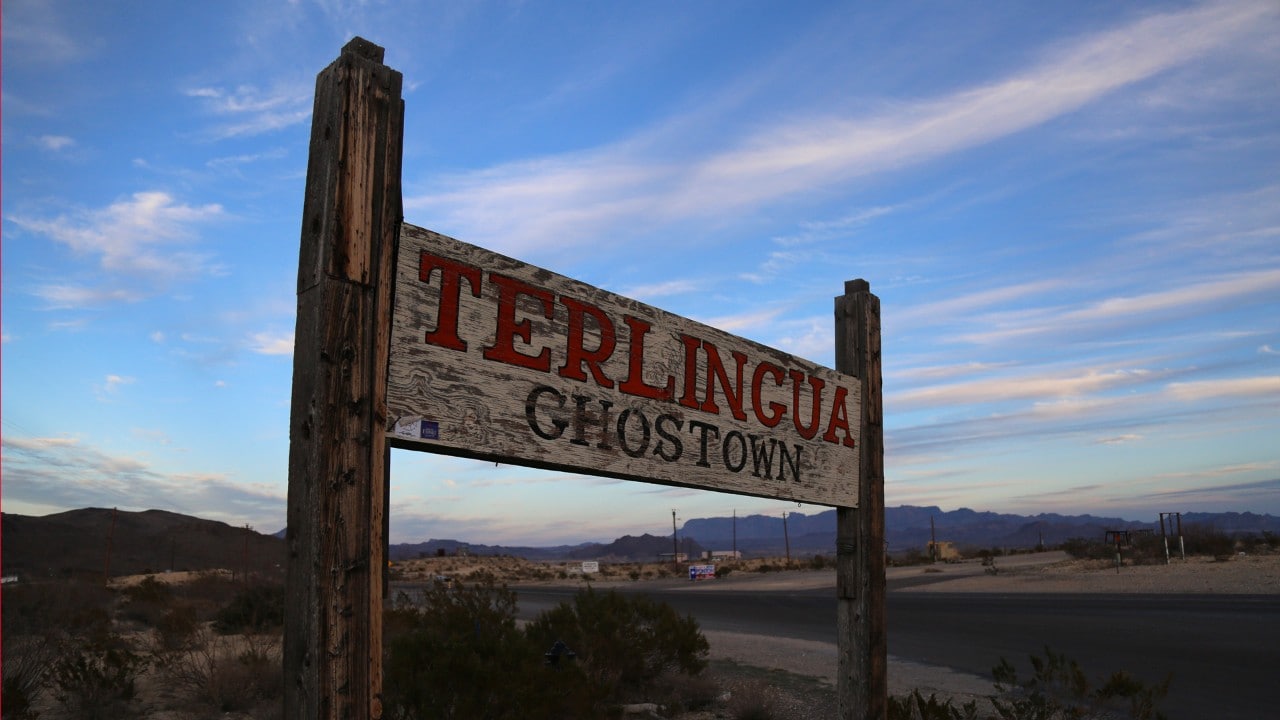 A weathered sign greets visitors on arrival.