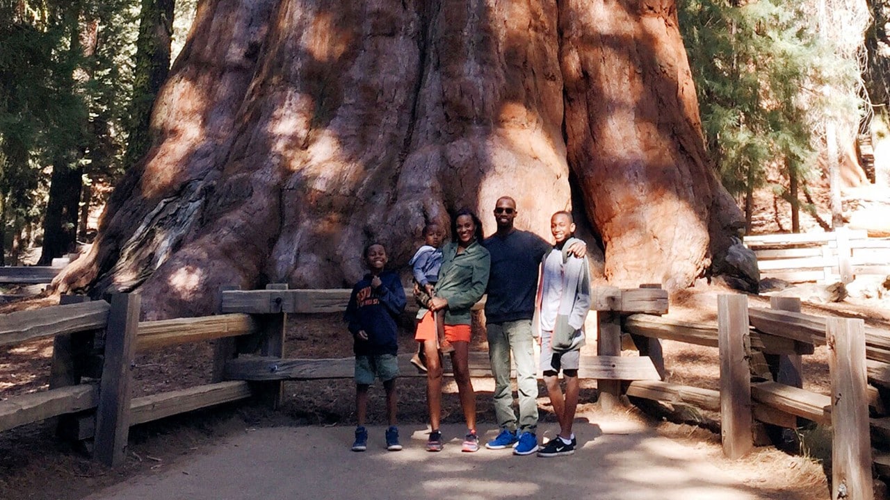 The Brown family at the General Sherman Tree in Sequoia National Park.