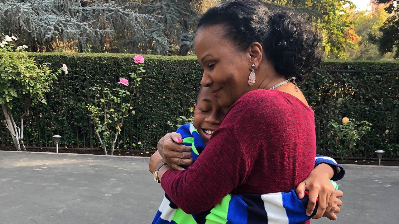 Sion Brown hugs his grandmother, Yvette Jones.